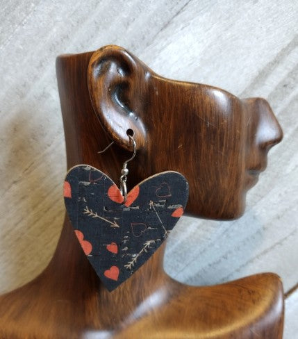 Heart with arrow earrings on brown earring display